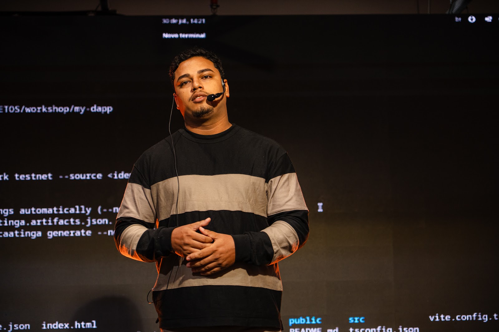 Workshop speaker in front of a live terminal projection