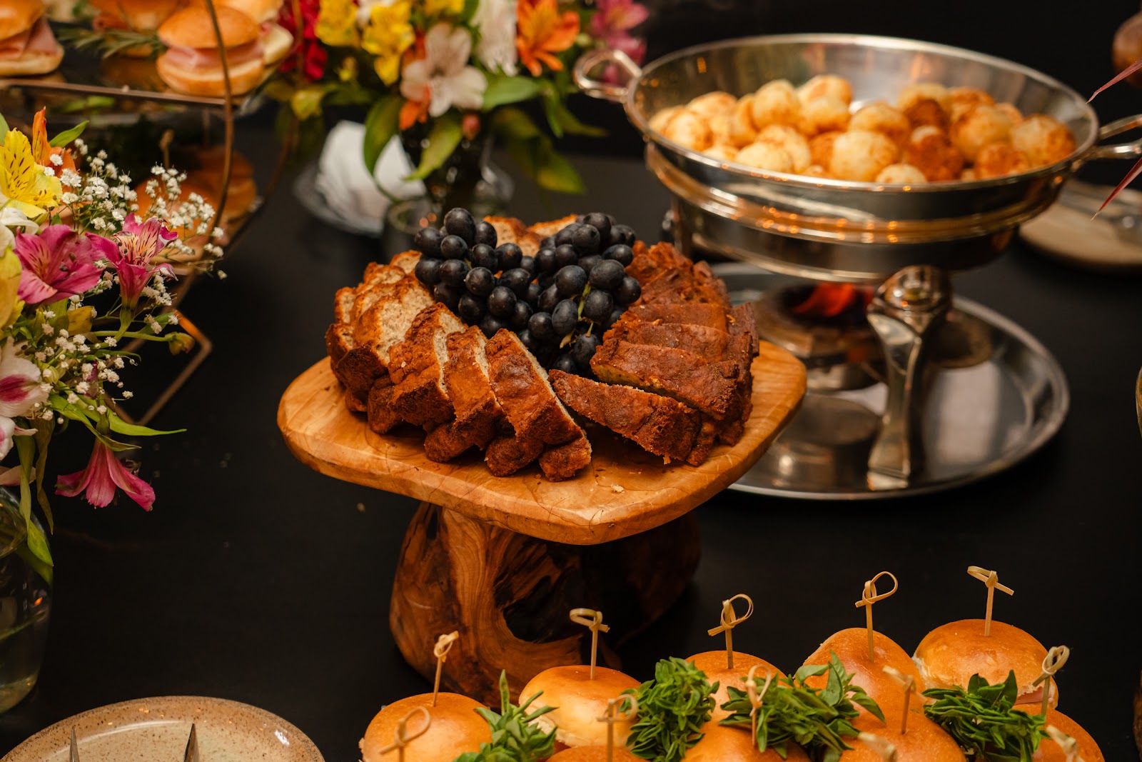 Buffet spread with flowers and finger food